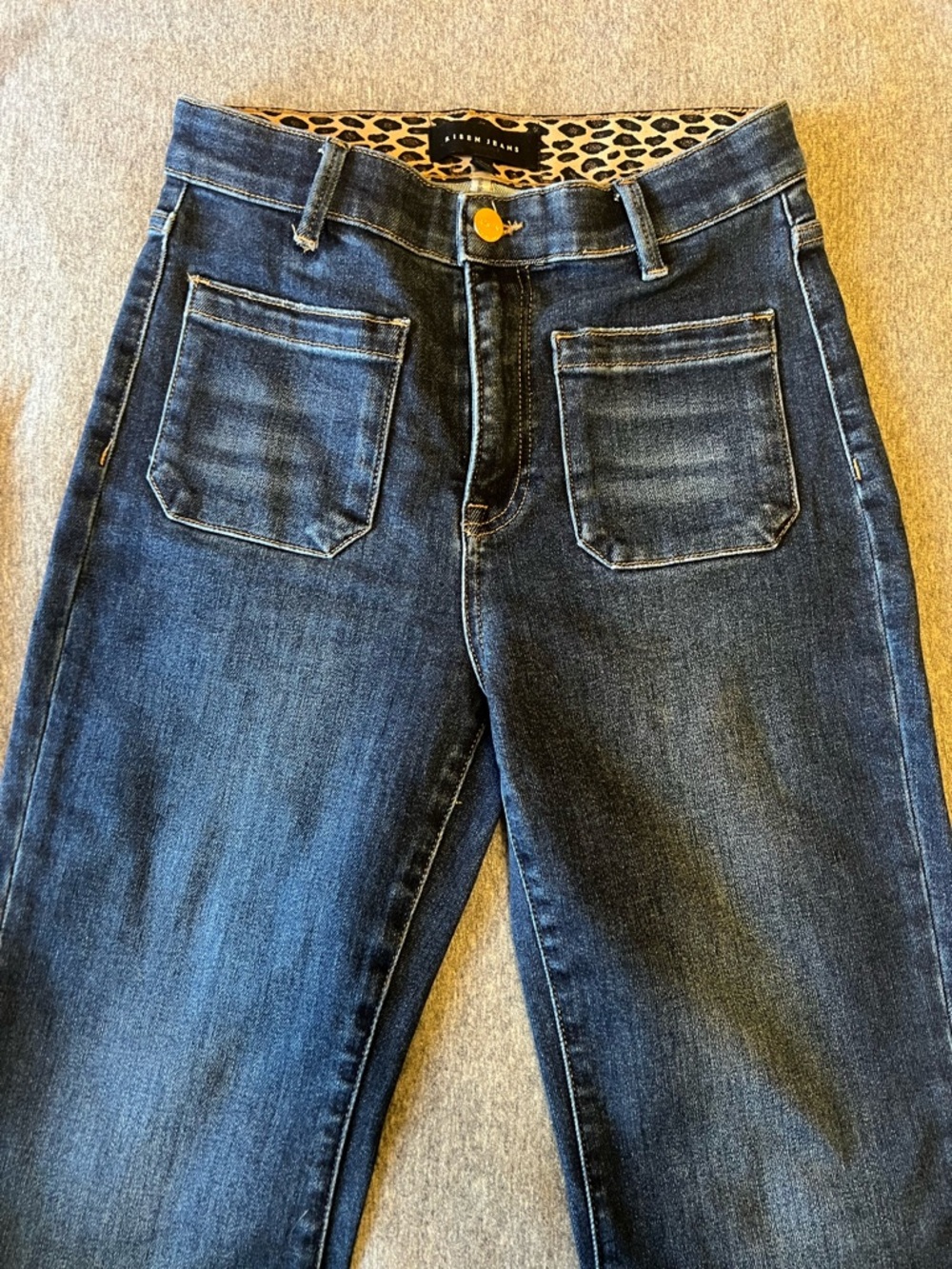 Risen High-Rise Front-Pocket Flare Jeans